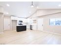 Bright, open kitchen with vaulted ceilings, black island, stainless steel appliances, and modern white cabinetry at 3601 Broadway Ave, North Las Vegas, NV 89030