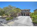 Inviting home with a two-car garage and well-maintained landscaping in a Gathering-friendly neighborhood at 5716 Breckenridge St, North Las Vegas, NV 89081