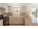 Functional kitchen with granite countertops and stainless steel appliances at 6601 W Pepperidge Way, Las Vegas, NV 89108