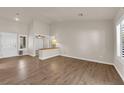 Bright living room featuring hardwood floors, neutral walls, and plenty of natural light at 8620 Prairie Hill Dr, Las Vegas, NV 89134