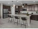 Spacious kitchen featuring a large island, stainless steel appliances, and pendant lighting at 1560 Pacific Baza St, Las Vegas, NV 89138