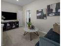 Cozy living room with a comfortable sofa, modern decor, and neutral colors at 1560 Pacific Baza St, Las Vegas, NV 89138