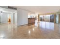 Spacious living room with tile floors, open floor plan, and city views at 3111 Bel Air Dr # 12E, Las Vegas, NV 89109