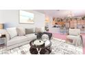 Inviting living room with a comfortable sofa and seamless flow to the kitchen at 4542 Silver Bit Ct, North Las Vegas, NV 89032