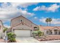 Charming two-story home with a well-maintained front yard, two car garage, and desert landscaping at 56 Westheimer Rd, Henderson, NV 89074