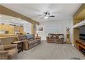 Spacious living room with neutral tones, plush seating, recessed lighting, and an open layout at 7013 Bisoni St, Las Vegas, NV 89149
