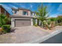 Charming two-story home with a desert landscaped yard and tile roof at 7837 Hamilton Pool Drive Dr, Las Vegas, NV 89113