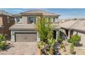 Charming two-story home with a desert landscaped yard and covered entryway at 7837 Hamilton Pool Drive Dr, Las Vegas, NV 89113
