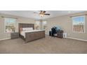 Spacious bedroom featuring neutral walls and carpeted floors, and a dedicated office area at 7837 Hamilton Pool Drive Dr, Las Vegas, NV 89113