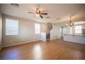 Bright living room featuring hardwood floors, neutral walls, and a ceiling fan at 8368 Creek Canyon Ave, Las Vegas, NV 89113
