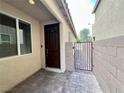 Inviting front entry showcasing a private courtyard and well-maintained brick paving at 4117 Midnight Crest Ave, North Las Vegas, NV 89031