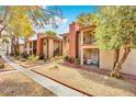 A multi-Gathering home exterior with landscaping and walkway at 5576 W Rochelle Ave # 9C, Las Vegas, NV 89103