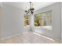 Open dining room with decorative chandelier and natural light at 5710 E Tropicana Ave # 1184, Las Vegas, NV 89122