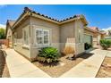 A well-kept exterior with desert landscaping and a concrete walkway leading to the front at 6057 Leaping Foal St, North Las Vegas, NV 89081
