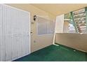 A cozy covered patio entrance to the condo featuring a metal security screen door at 338 Jett St # 101, Las Vegas, NV 89145