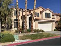 Two-story house with attached garage and landscaping at 1662 Ravanusa Dr, Henderson, NV 89052