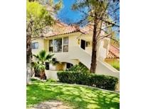 Charming multi-level home with a red tile roof and lush landscaping at 2605 S Durango Dr # 204, Las Vegas, NV 89117