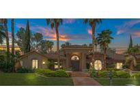 Elegant single-story home with manicured landscaping, a welcoming entrance, and a large front yard at 1813 Skyline Dr, Las Vegas, NV 89117