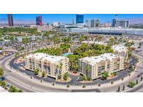 Aerial view of Casablanca condos, showing building exteriors, pool, and tennis court at 725 N Royal Crest Cir # 214, Las Vegas, NV 89169