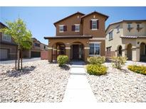 Inviting two-story home with well-maintained landscaping and charming front porch at 5713 Heineken Dr, North Las Vegas, NV 89031