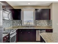 Gourmet kitchen with granite countertops, stainless steel appliances, and mountain view at 8255 S Las Vegas Blvd # 1521, Las Vegas, NV 89123