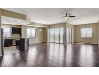 Open living room with hardwood floors and city views at 8255 S Las Vegas Blvd # 1521, Las Vegas, NV 89123