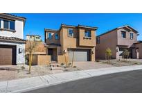 Two-story house with gray garage door and landscaping at 106 Via Franello, Henderson, NV 89011