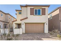 Two-story house with brown garage door and Spanish tile roof at 8897 Faxom St, Las Vegas, NV 89166