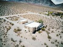 Desert home with separate structure featuring neutral tones and beautiful desert surroundings at , Pahrump, NV 89060
