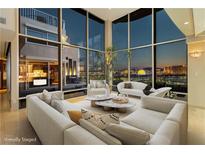 Bright living room with floor-to-ceiling windows and city views, offering a stylish and modern design at 3111 Bel Air Dr # 28C, Las Vegas, NV 89109