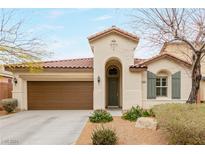 Charming single-story home features a tile roof, stucco exterior, and a two-car garage at 8752 Younts Peak Ct, Las Vegas, NV 89178