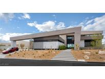 Stunning contemporary home featuring a unique architectural design and well-manicured desert landscaping at 12 Chisel Crest Ct, Henderson, NV 89012