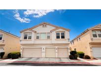 Two-story home with attached three-car garage and landscaped yard at 9333 Leaping Deer Pl # 102, Las Vegas, NV 89178