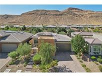 Single-story home with desert landscape and mountain views at 10057 Regency Canyon Way, Las Vegas, NV 89148