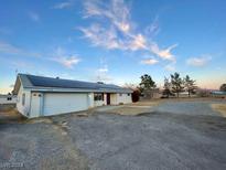 Single story home with solar panels and large yard at 1310 Fremont St, Pahrump, NV 89048