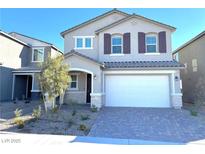 Two-story house with a white garage door and landscaping at 7160 Port Stephens St, North Las Vegas, NV 89084