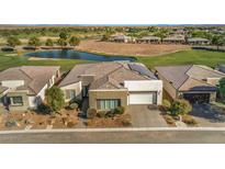 Single-story home with desert landscaping, golf course, and pond views at 4775 E Beacon Ridge Dr, Pahrump, NV 89061