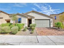Charming single-story home features a well-manicured front yard, brick driveway, and attached two-car garage at 3716 W Colton Ave, North Las Vegas, NV 89032