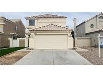 Inviting two-story home featuring an attached two-car garage and desert landscaping at 367 Lander Dr, Henderson, NV 89074