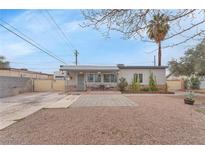 Charming single-story home featuring a landscaped front yard and cozy porch area at 1334 Eastwood Dr, Las Vegas, NV 89104