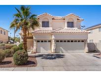 Two-story house with two-car garage and desert landscaping at 2196 Pescara Ct, Las Vegas, NV 89123