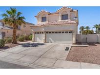 Two-story house with a two-car garage and desert landscaping at 2196 Pescara Ct, Las Vegas, NV 89123