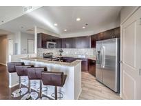 Modern kitchen with granite countertops and stainless steel appliances at 8255 Las Vegas Blvd # 1819, Las Vegas, NV 89123