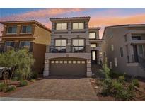 Three-story house with a two-car garage and landscaped yard at 7646 Sandhaven St, Las Vegas, NV 89139