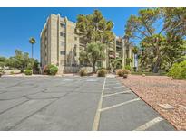 Lovely building exterior with well-maintained parking and landscaping at 750 S Royal Crest Cir # 353, Las Vegas, NV 89169