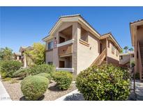 Inviting two-story condo with private balcony and well-maintained landscaping, offering a serene community setting at 1050 E Cactus Ave # 2104, Las Vegas, NV 89183