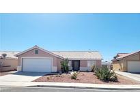 One-story house with desert landscaping and a two-car garage at 213 Beaver Ridge Ave, North Las Vegas, NV 89031