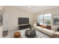 Bright living room featuring a comfy sofa, large TV, and coffee table at 8000 Badura Ave # 2165, Las Vegas, NV 89113