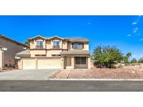Charming two-story home with a three-car garage and beautifully landscaped front yard at 8224 Cassis Ct, Las Vegas, NV 89117