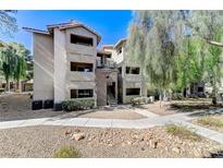 Multi-level condo building with desert landscaping, walkway, and stairs to upper units at 4200 S Valley View Blvd # 3092, Las Vegas, NV 89103